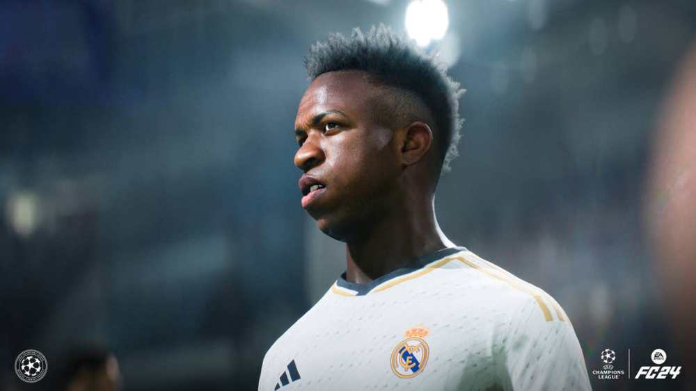 Vinicius Jr standing in his Real Madrid kit, under the lights at the Bernabeu Stadium. 