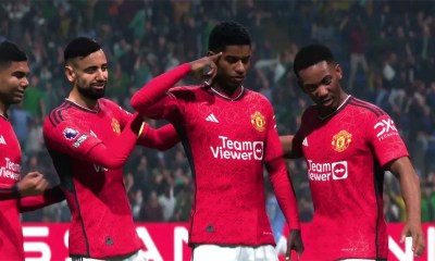 Marcus Rashford doing his celebration, with Anthony Martial, Bruno Fernandes, and Casemiro standing beside him.
