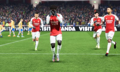 Bukayo Saka hitting the Griddy at Arsenal with teammates around him.