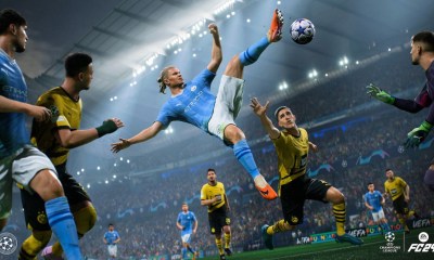 Erling Haaland jumping at a ball against Borussia Dortmund